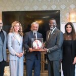 Zaman Mehdi presents a Made-in-Pakistan football to Chicago Mayor Brandon Johnson
